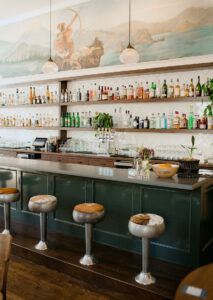 The Bar at Paloma with mural in the background