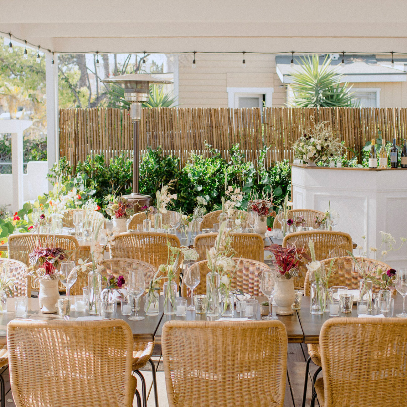 Tables and bar set up on the patio for a private event